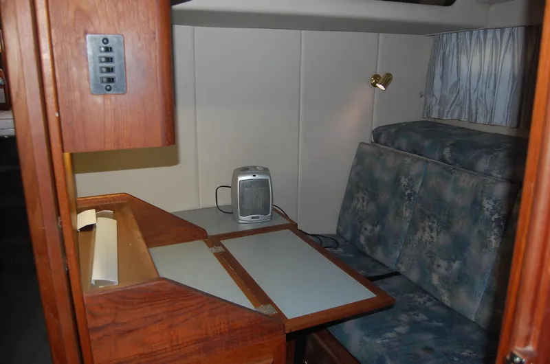 Slide: The Image of 1992 Bayliner 4588 Pilothouse MY interior with desk, seating, and lamp. - 39