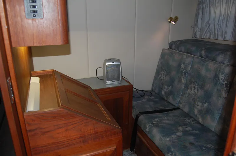 Slide: The Image of Interior of 1992 Bayliner 4588 Pilothouse MY with desk, seating, and heater. - 40