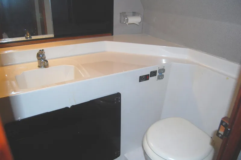 Slide: The Image of Bathroom interior of 1992 Bayliner 4588 Pilothouse MY yacht, featuring sink and toilet. - 45
