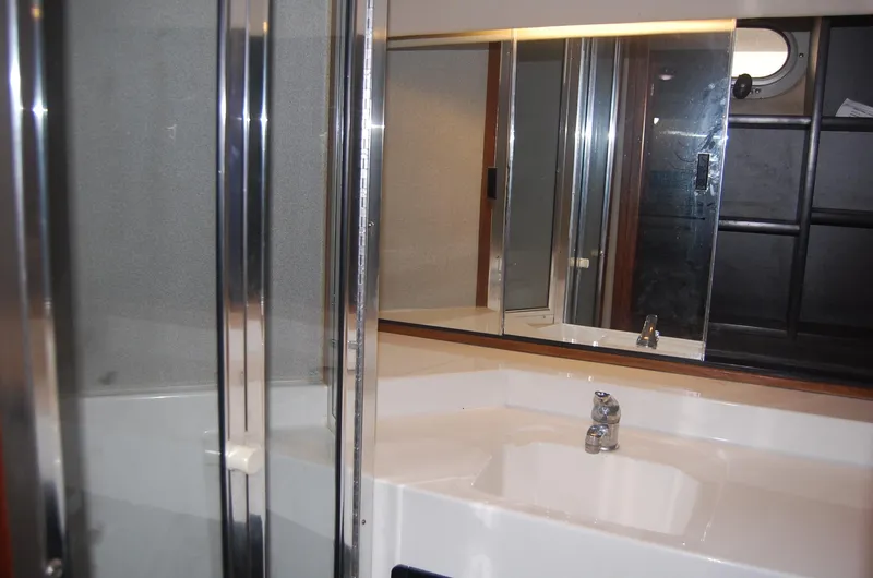 Slide: The Image of Bathroom interior of 1992 Bayliner 4588 Pilothouse MY with sink and mirror. - 46