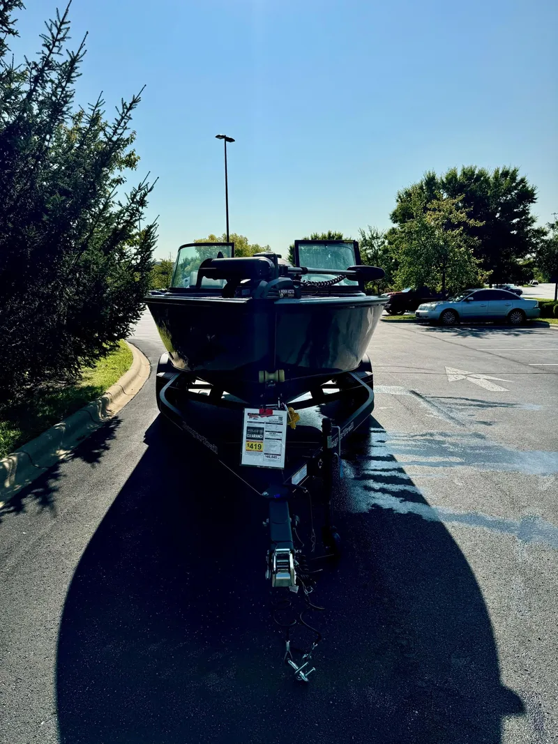 Slide: The Image of 2023 Ranger VS1882SC Angler boat parked in sunny lot. - 2