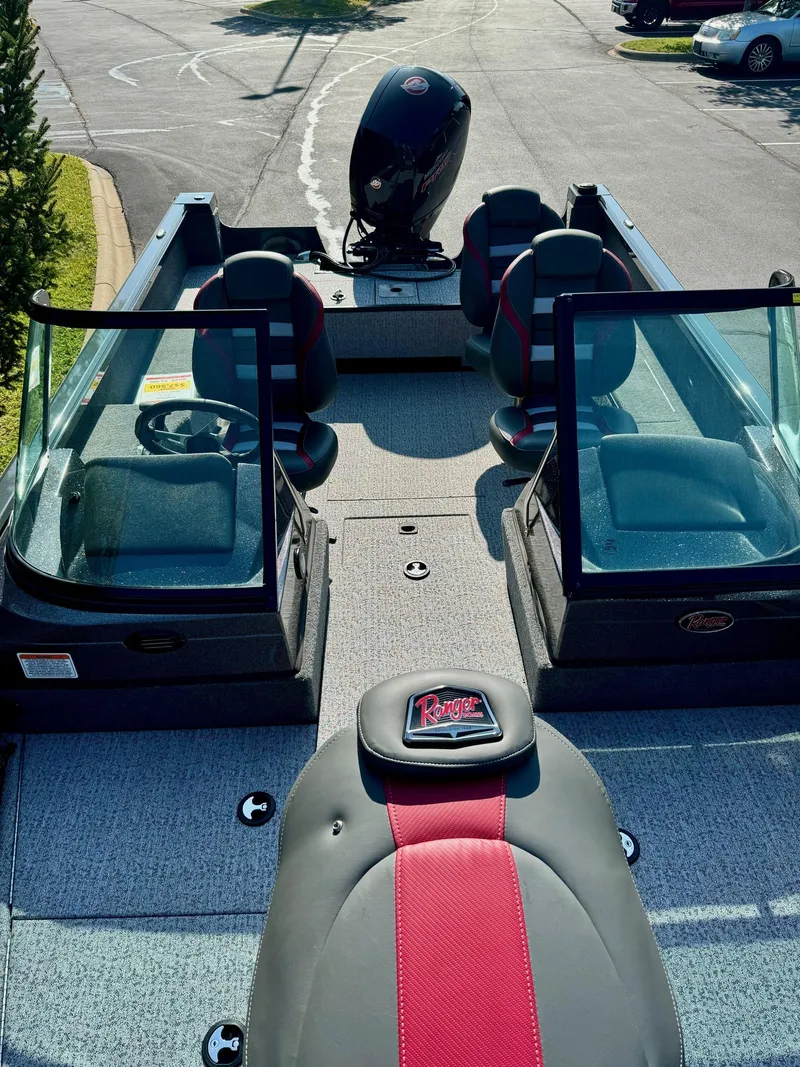 Slide: The Image of 2023 Ranger VS1882SC Angler boat with dual consoles and seating, parked outdoors. - 4
