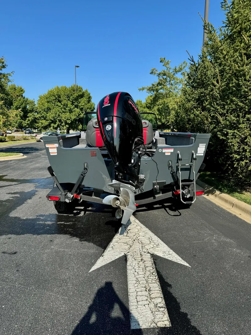 Slide: The Image of 2023 Ranger VS1882SC Angler boat with outboard motor on a sunny day. - 5