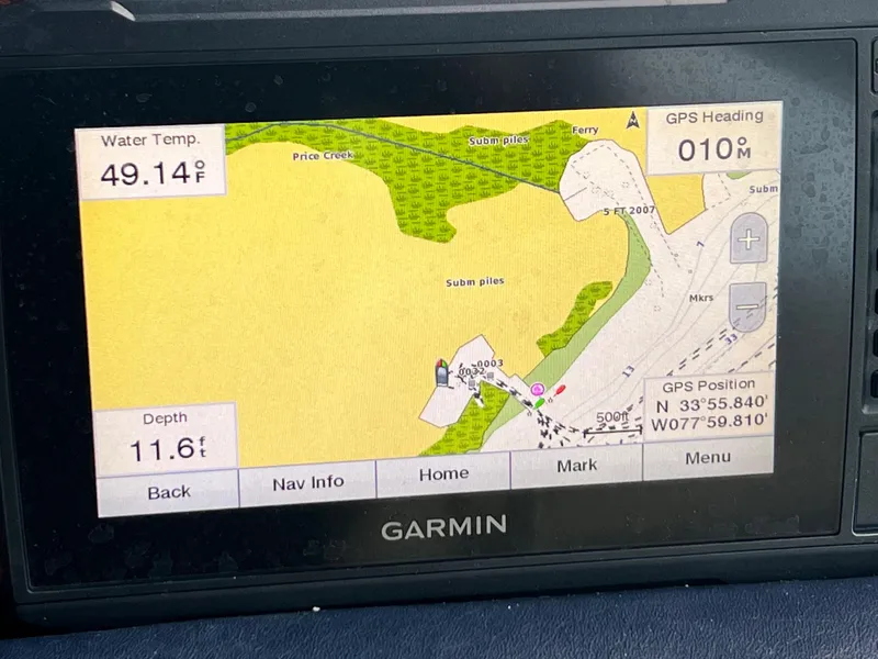 Slide: The Image of Garmin GPS display on a 1993 Sea Ray 440 Sundancer showing water temperature and depth. - 32