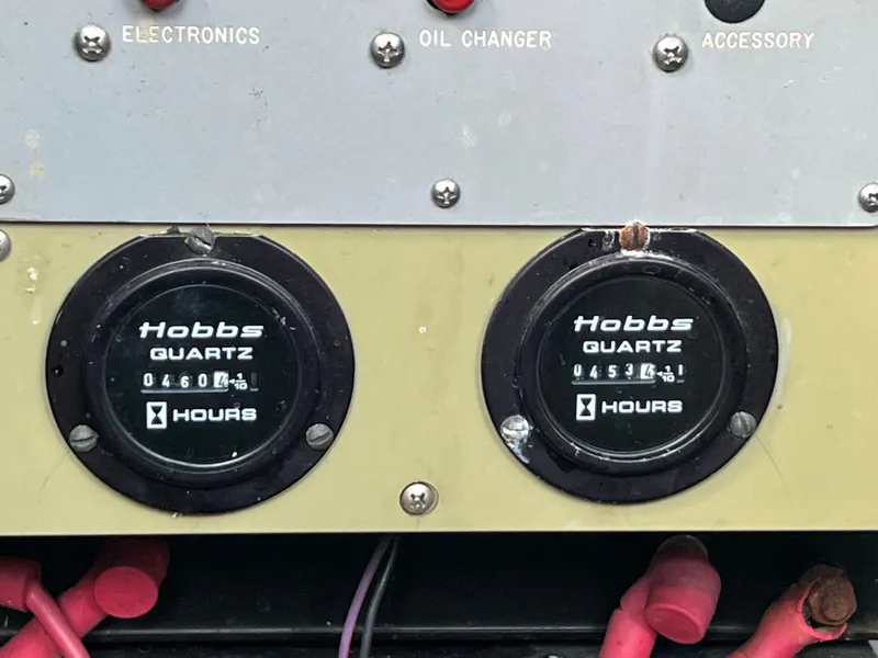Slide: The Image of Hobbs hour meters on a 1993 Sea Ray 440 Sundancer boat dashboard. - 34