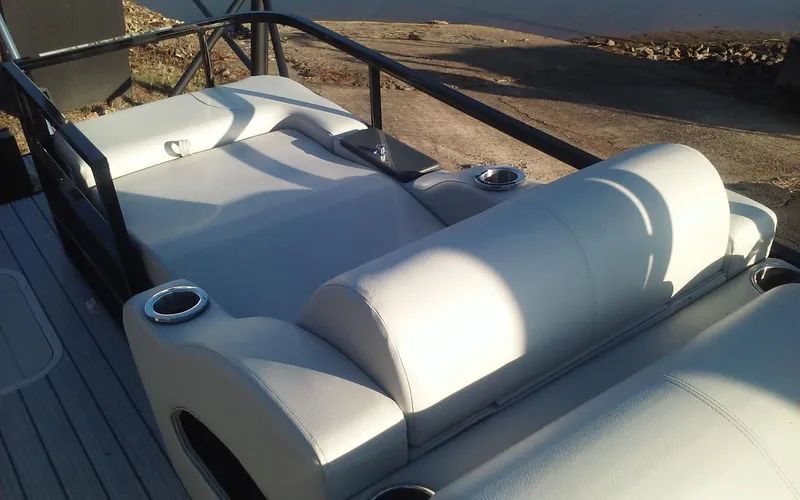 Slide: The Image of 2023 SunCatcher Fusion 324 SS boat with plush seating and cup holders. - 14