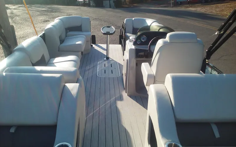 Slide: The Image of 2023 SunCatcher Fusion 324 SS boat interior with luxurious seating and modern design. - 19