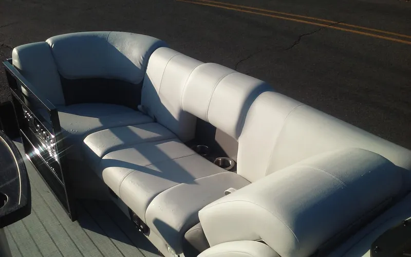 Slide: The Image of 2023 SunCatcher Fusion 324 SS boat interior with plush white seating. - 24