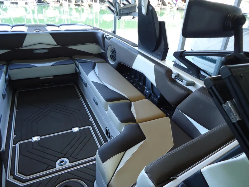 Slide: The Image of 2018 Supra SL boat interior with modern seating and sleek design. - 17