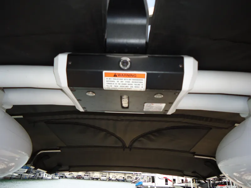 Slide: The Image of 2018 Supra SL boat interior with warning label and equipment. - 34