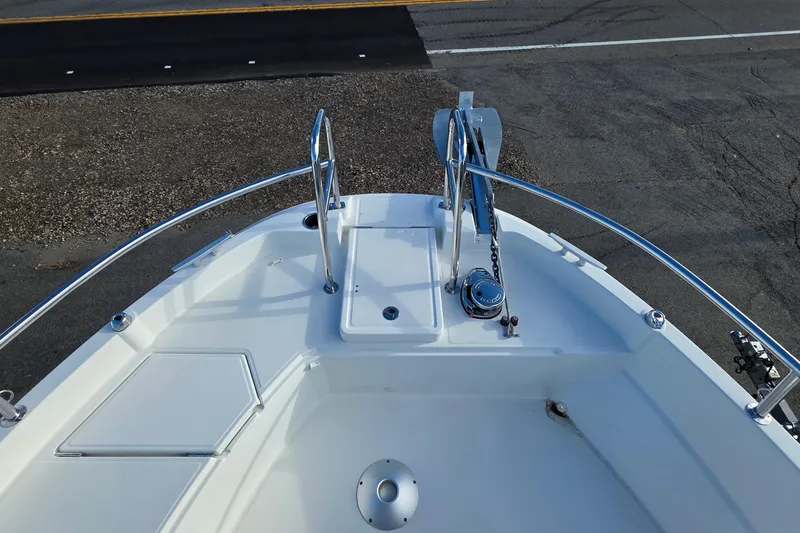 Slide: The Image of 2024 Jeanneau NC 895 Sport boat deck with anchor and railing. - 34