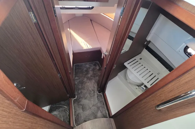 Slide: The Image of 2024 Jeanneau NC 895 Sport interior with cozy cabin and compact bathroom. - 40