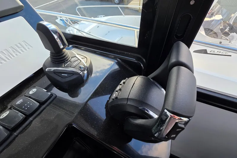 Slide: The Image of Control panel of 2024 Jeanneau NC 895 Sport boat with Yamaha joystick and throttle. - 55