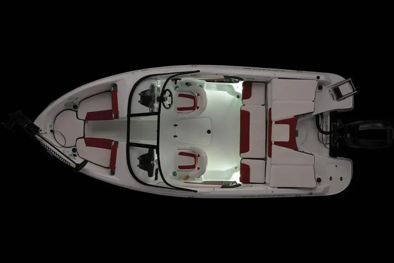 Slide: The Image of 2023 Tahoe 200 S boat, top view, illuminated interior, red and white seating. - 5