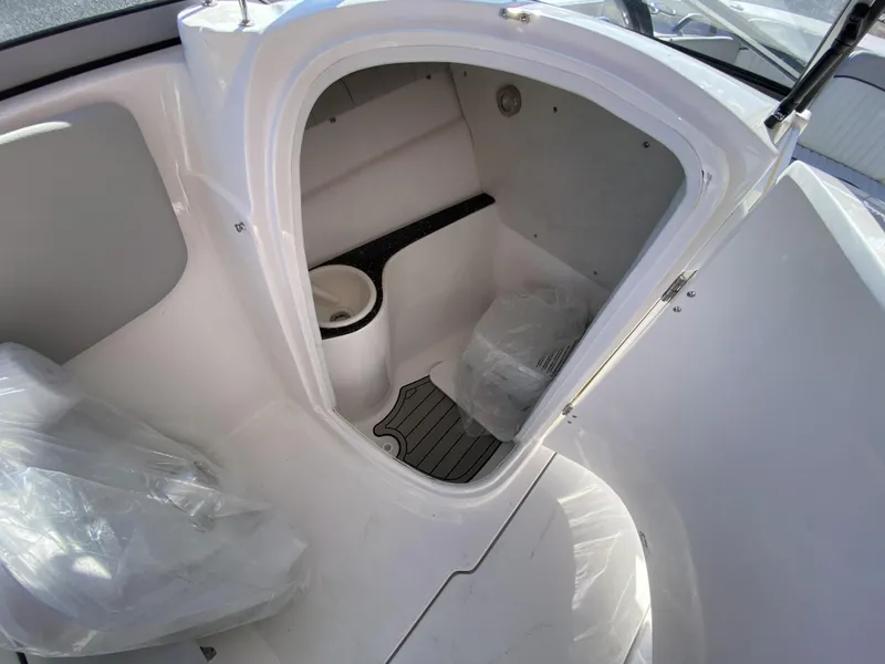 Slide: The Image of 2023 Sea Fox 226 Traveler boat interior cabin with storage and seating. - 15