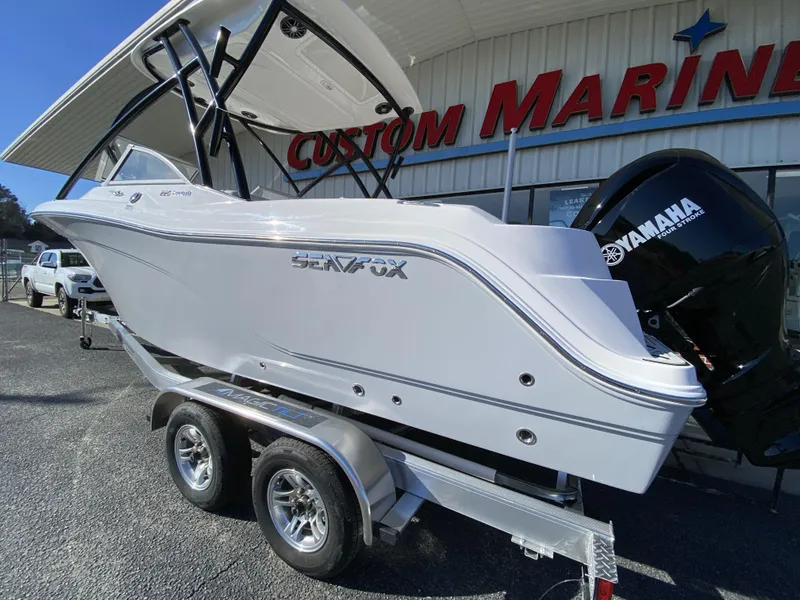 Slide: The Image of 2023 Sea Fox 226 Traveler boat on trailer at Custom Marine dealership. - 3