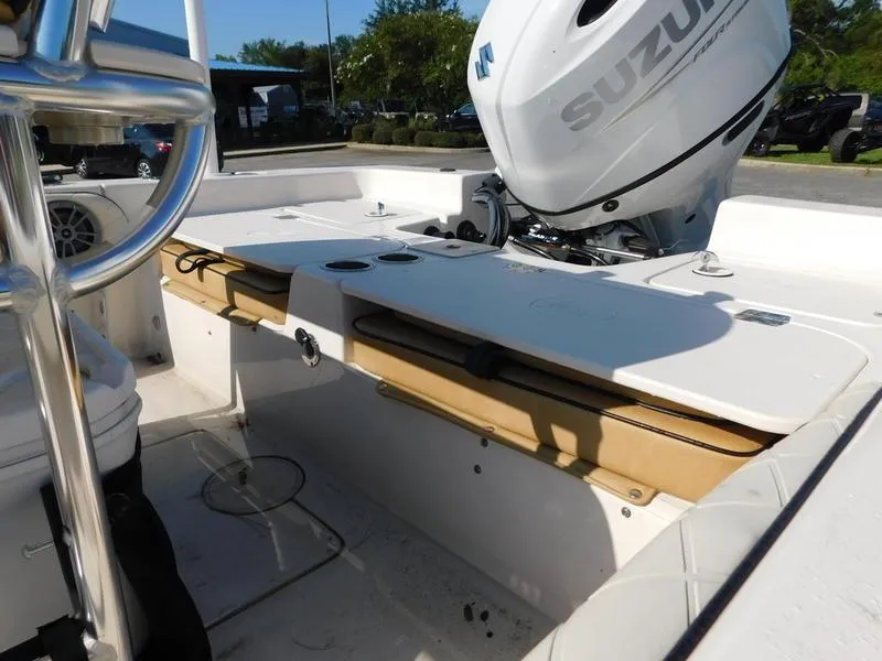 Slide: The Image of 2023 Carolina Skiff 19 Ultra Elite boat interior with Suzuki outboard motor. - 10