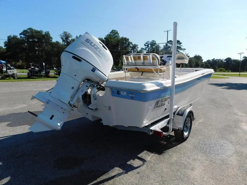 Slide: The Image of 2023 Carolina Skiff 19 Ultra Elite boat with Suzuki outboard motor on trailer. - 11