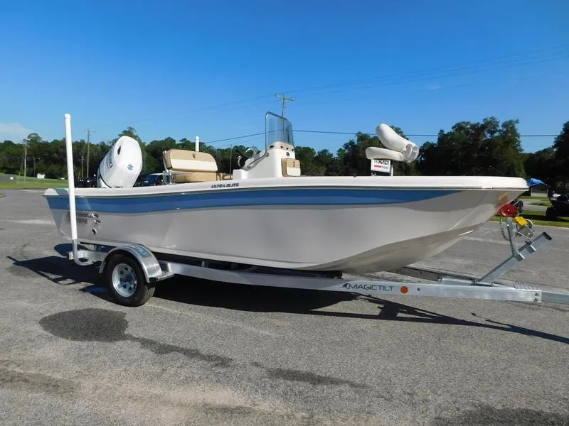 Slide: The Image of 2023 Carolina Skiff 19 Ultra Elite boat on a trailer in a parking lot. - 4