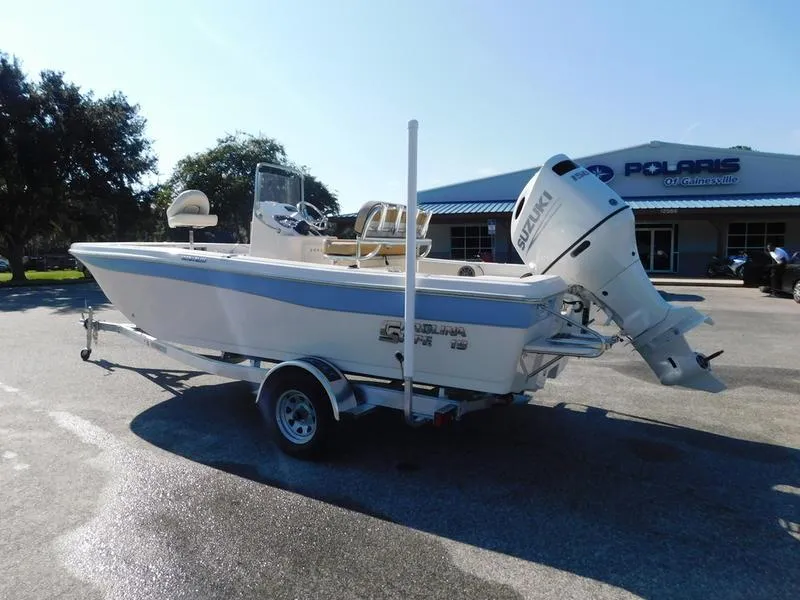 Slide: The Image of 2023 Carolina Skiff 19 Ultra Elite boat on trailer with Suzuki outboard motor. - 5