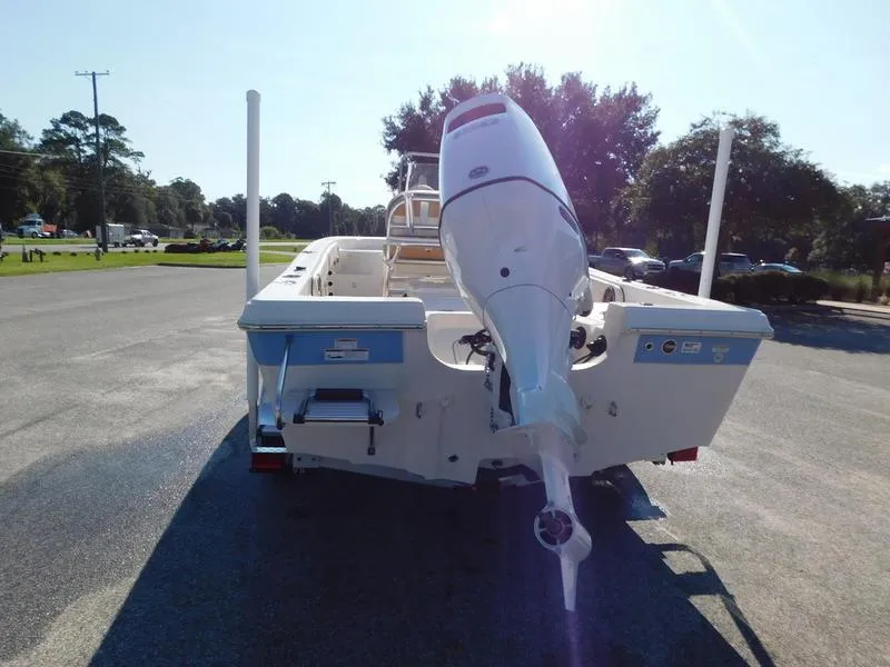 Slide: The Image of 2023 Carolina Skiff 19 Ultra Elite boat rear view with outboard motor. - 6