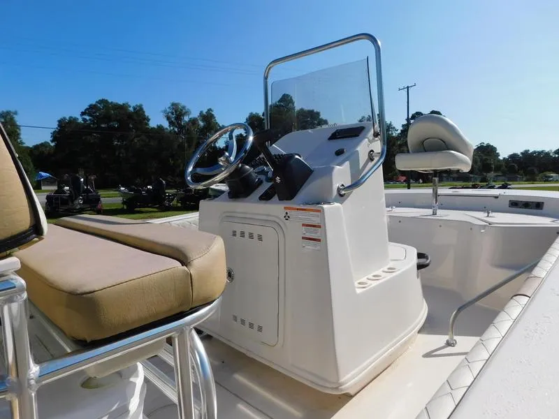 Slide: The Image of 2023 Carolina Skiff 19 Ultra Elite boat console and seating area. - 8