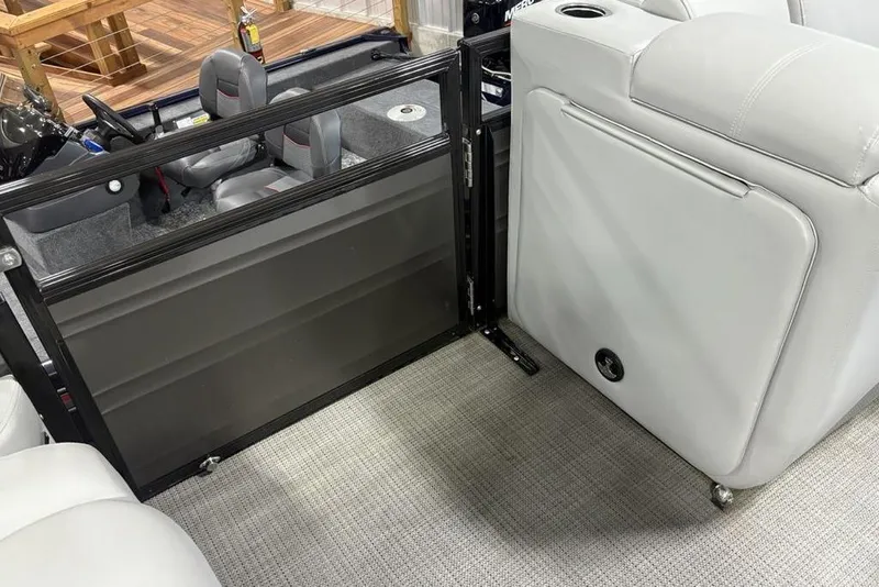 Slide: The Image of 2023 Regency 230 DL3 boat interior with seating and helm area, featuring modern design elements. - 19