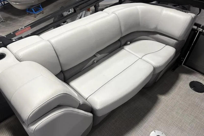 Slide: The Image of Luxurious seating in 2023 Regency 230 DL3 pontoon boat, featuring plush, light gray upholstery. - 37