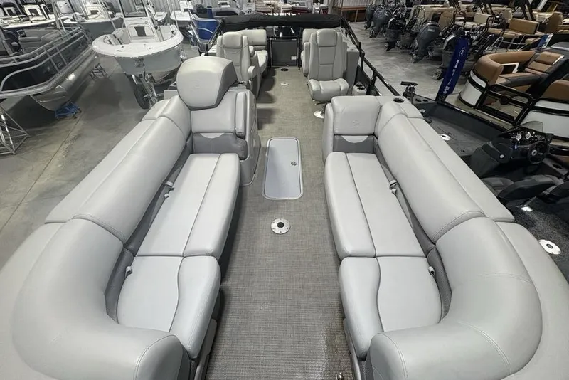 Slide: The Image of 2023 Regency 230 DL3 pontoon boat interior with spacious gray seating. - 42