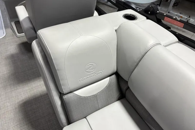 Slide: The Image of Luxurious seating in 2023 Regency 230 DL3 boat with cup holder and logo. - 47