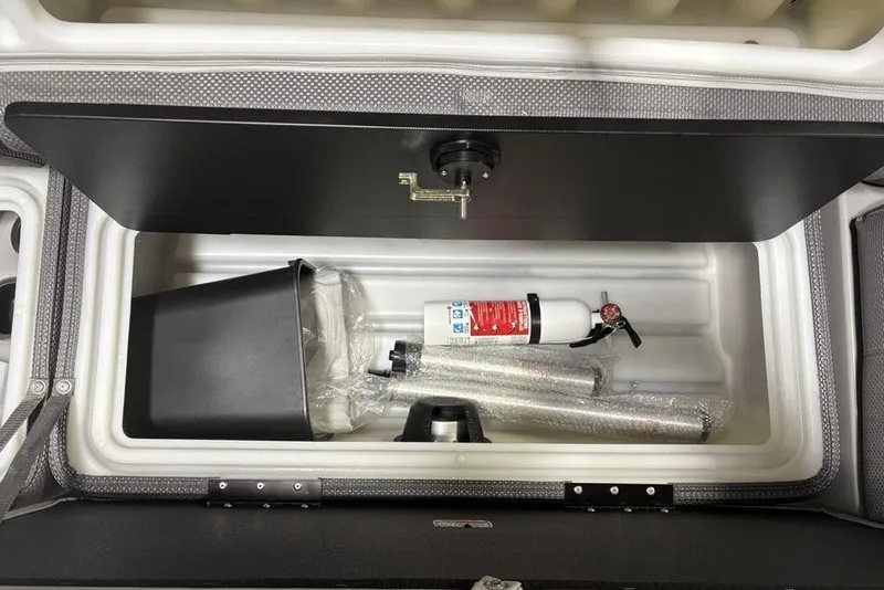Slide: The Image of Storage compartment of 2023 Regency 230 DL3 with fire extinguisher and accessories. - 8