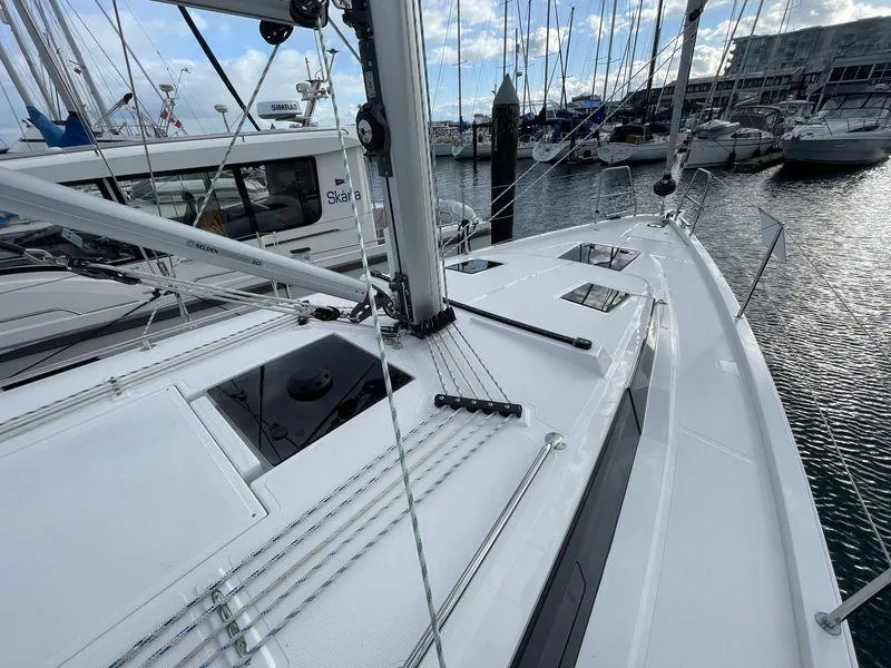 Slide: The Image of 2023 Bavaria C38 yacht deck, marina view, sleek design, modern sailing vessel. - 17