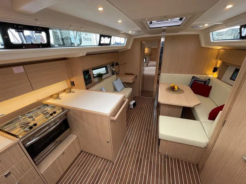 Slide: The Image of Luxurious 2023 Bavaria C38 yacht interior with modern kitchen and cozy seating area. - 18