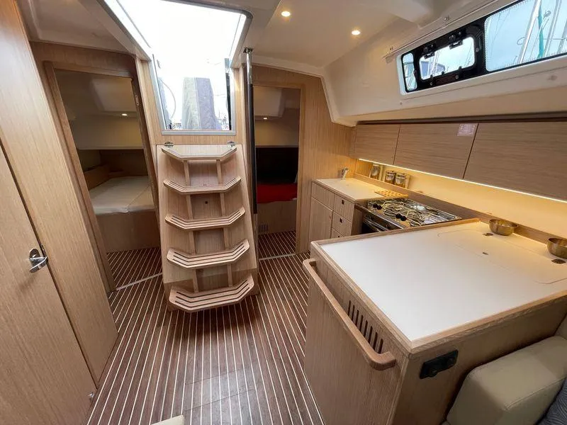 Slide: The Image of Interior of 2023 Bavaria C38 yacht with modern kitchen and wooden finishes. - 21