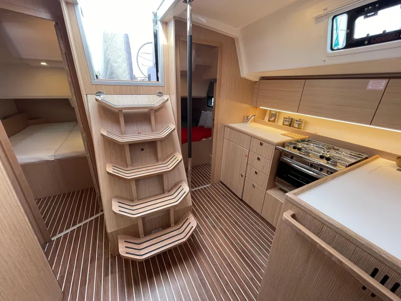 Slide: The Image of Interior of 2023 Bavaria C38 yacht with modern kitchen and wooden flooring. - 22