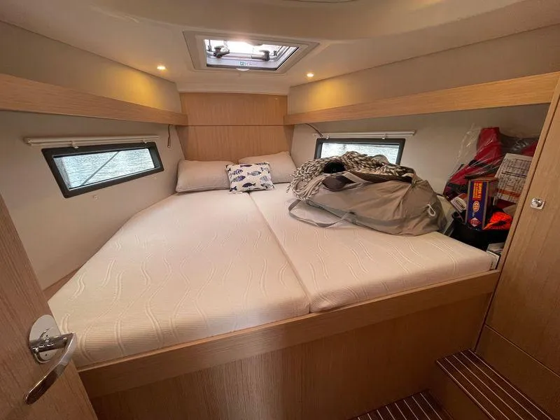 Slide: The Image of Cozy cabin interior of 2023 Bavaria C38 yacht with bed and storage. - 24