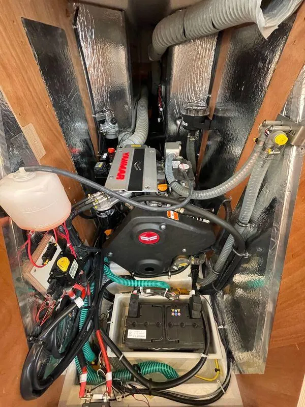 Slide: The Image of Engine compartment of 2023 Bavaria C38 yacht with visible wiring and components. - 30