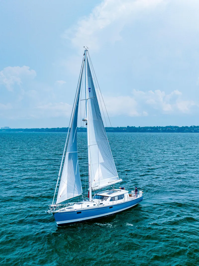 Slide: The Image of 2025 Tartan 455 sailboat cruising on open water. - 1
