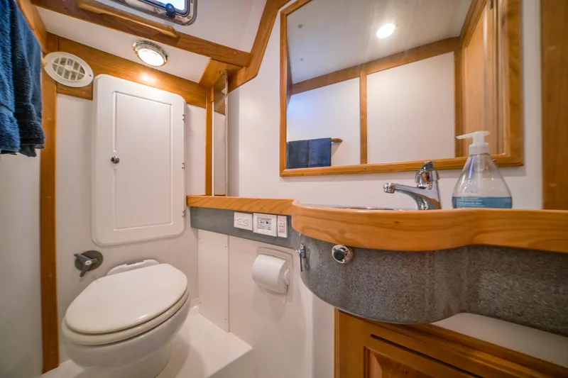 Slide: The Image of Modern bathroom in 2025 Tartan 455 yacht with wooden accents and compact design. - 23