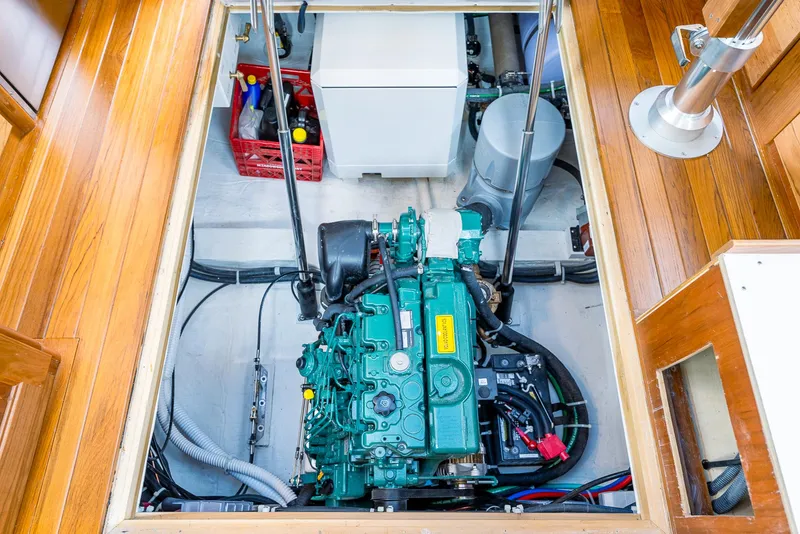 Slide: The Image of Engine compartment of a 2025 Tartan 455 sailboat with visible machinery and equipment. - 27