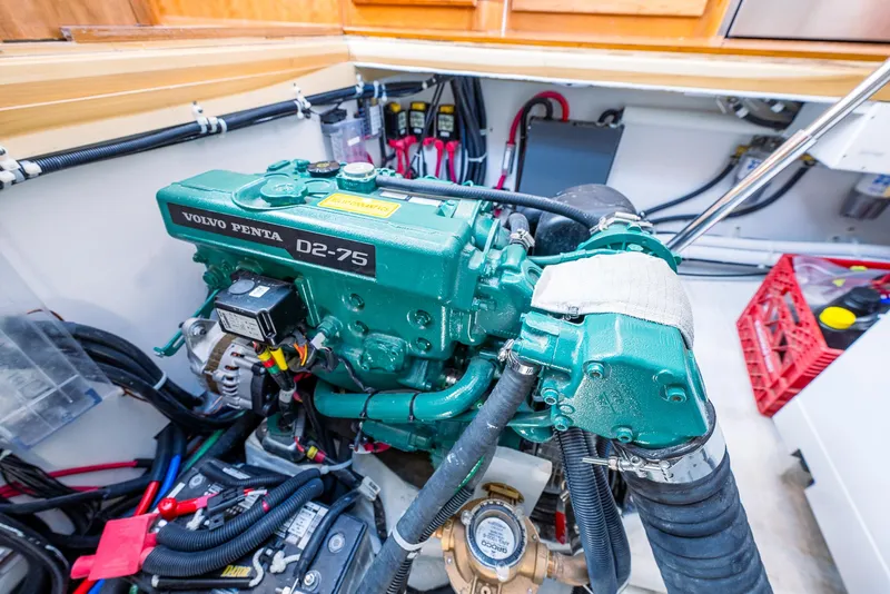 Slide: The Image of Engine compartment of a 2025 Tartan 455 sailboat with a Volvo Penta D2-75 engine. - 30