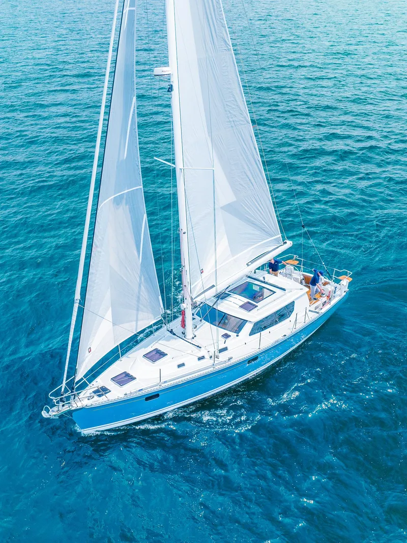 Slide: The Image of 2025 Tartan 455 sailboat cruising on clear blue ocean waters - 7