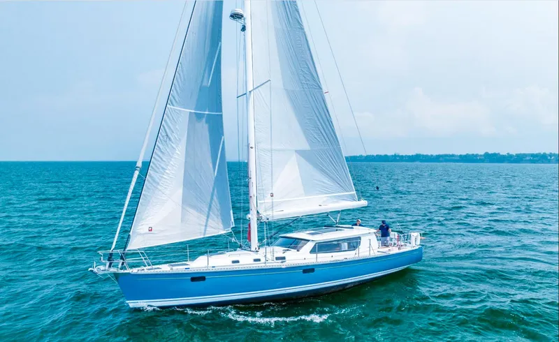 Slide: The Image of 2025 Tartan 455 sailboat cruising on open water. - 8