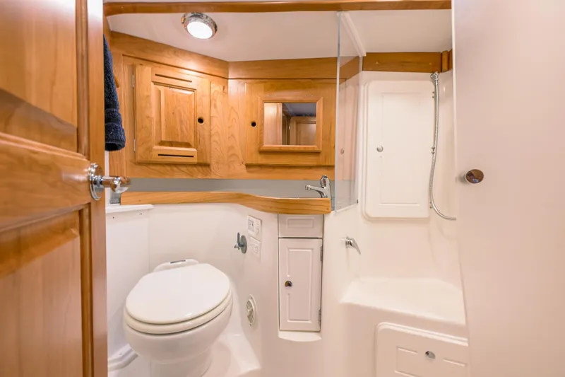 Slide: The Image of Modern bathroom in 2025 Tartan 455 yacht with wooden cabinetry and white fixtures. - 18