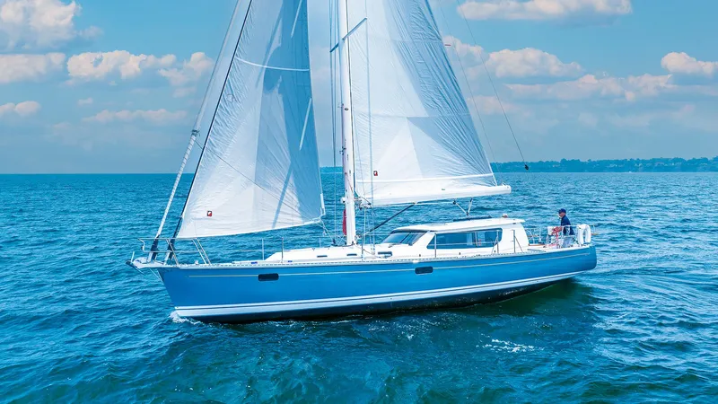 Slide: The Image of Modern Tartan 455 sailboat cruising on open water, 2025 model. - 0