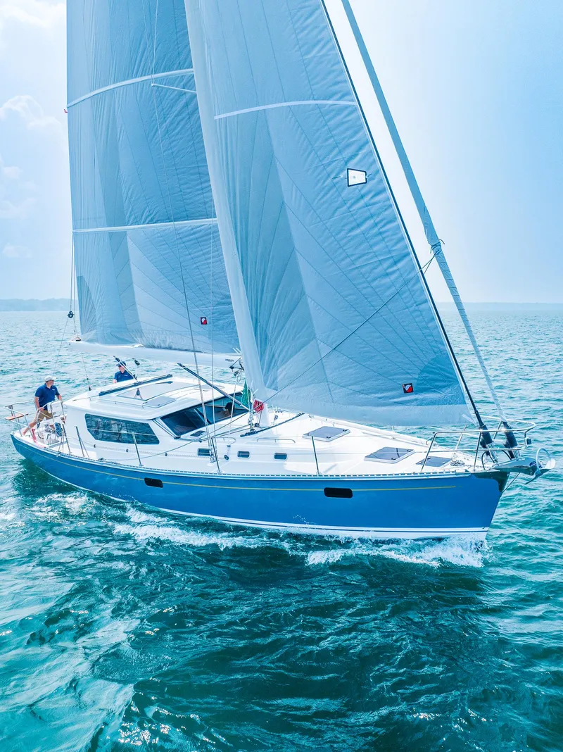 Slide: The Image of 2025 Tartan 455 sailboat cruising on open water. - 1