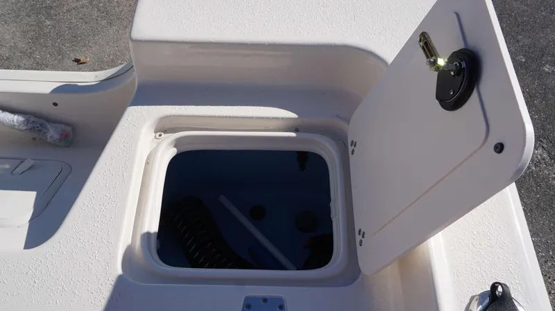 Slide: The Image of Open storage compartment on 2023 Carolina Skiff 21 Ultra Elite boat. - 11