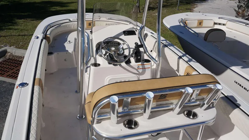 Slide: The Image of 2023 Carolina Skiff 21 Ultra Elite boat interior with steering console and seating. - 6