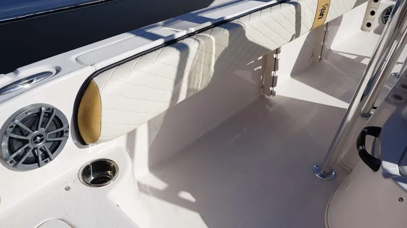 Slide: The Image of 2023 Carolina Skiff 21 Ultra Elite interior with cushioned seating and speaker. - 8