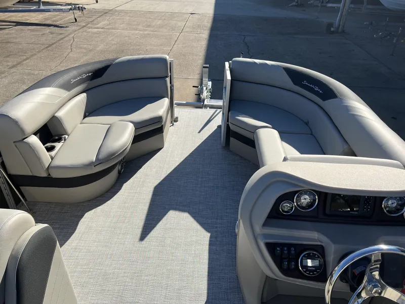 Slide: The Image of 2023 South Bay 220CR LE 2.0 pontoon boat interior with plush seating and modern dashboard. - 4